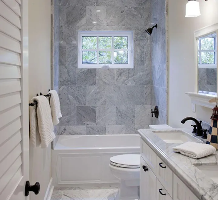 Budget-friendly bathroom makeover with marble-look tile in Glen Burnie, MD