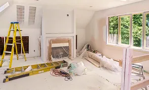 Residential remodeling site in progress with ladder and tools